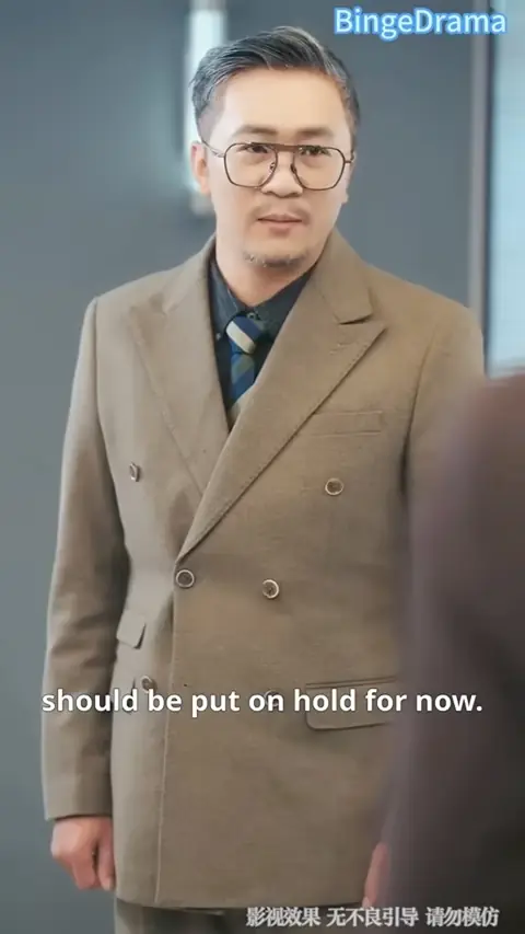 Camel double-breasted overcoat with striped tie, still at 13:40 in The Heiress Her Fiancé Called Trash