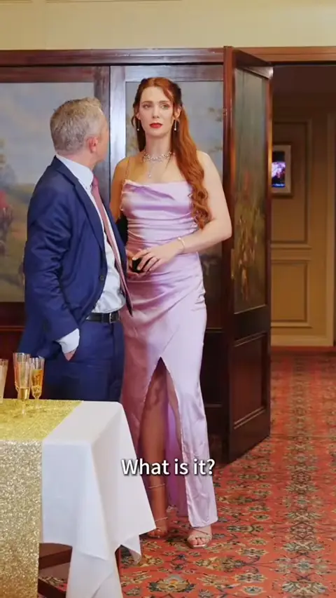 Lilac satin cowl-neck slit gown and a navy suit, in Billionaire Heiress Went Undercover as a Cleaner