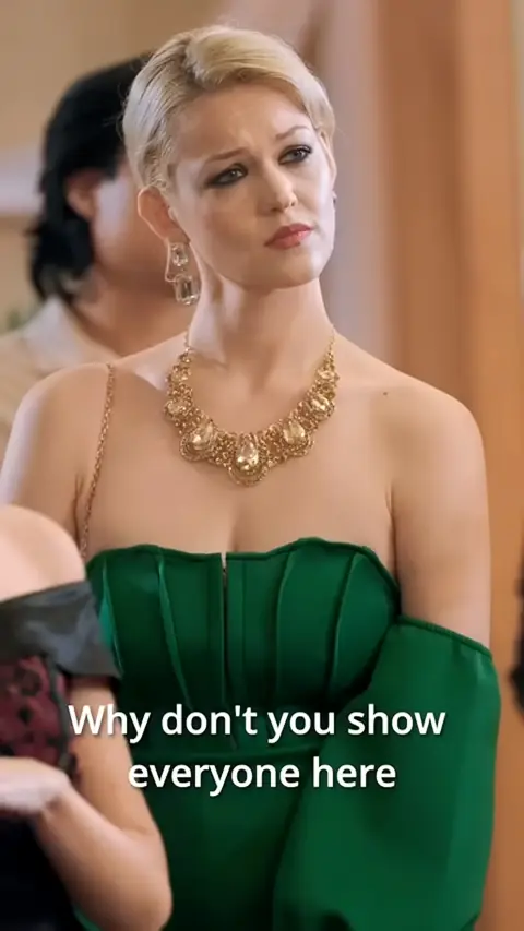 Green strapless satin dress with gold statement necklace, in You Bullied the Wrong Woman