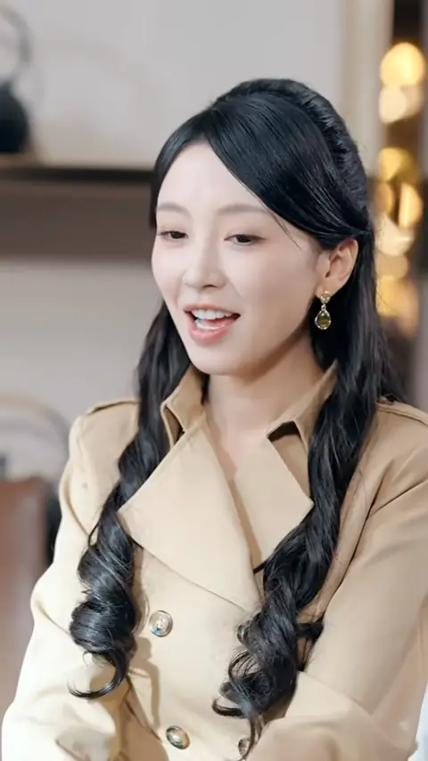 Camel trench coat with gold drop earrings, still at 19:10 in For Money, She Became a CEO's Contract Wife, but He Fell in Love