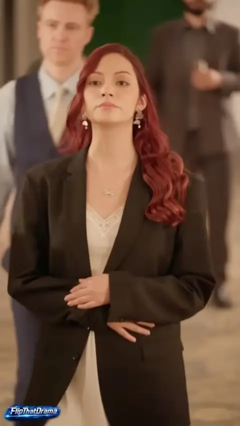 Black oversized blazer over a cream lace camisole, still at 1:03:08 in The Mafia King at His Wife's Wedding