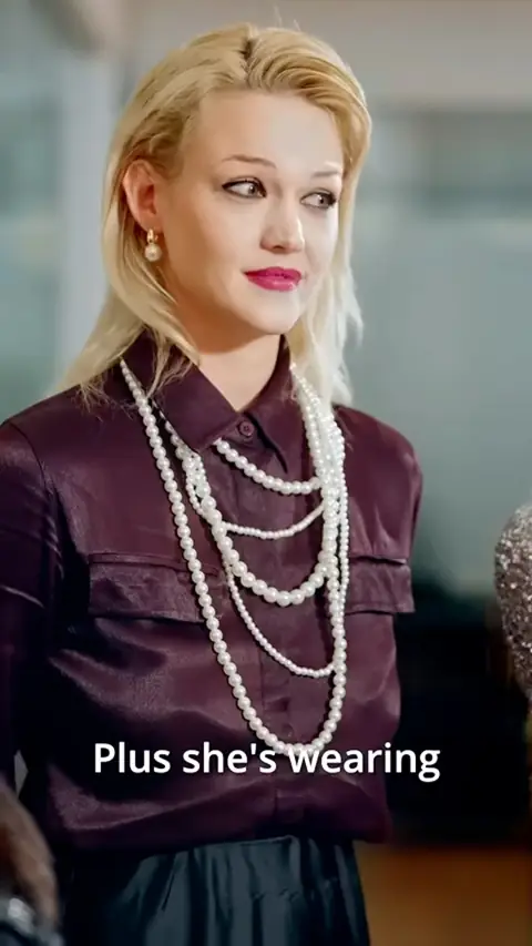 Burgundy satin shirt with layered pearl necklaces, in You Bullied the Wrong Woman