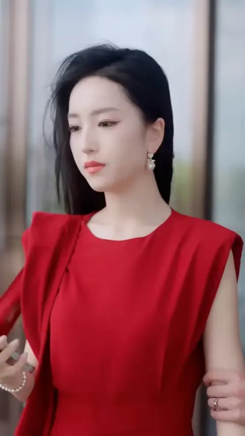 Red sleeveless cape-shoulder dress with pearl earrings, in CEO Saw Wife as Substitute for His First Love
