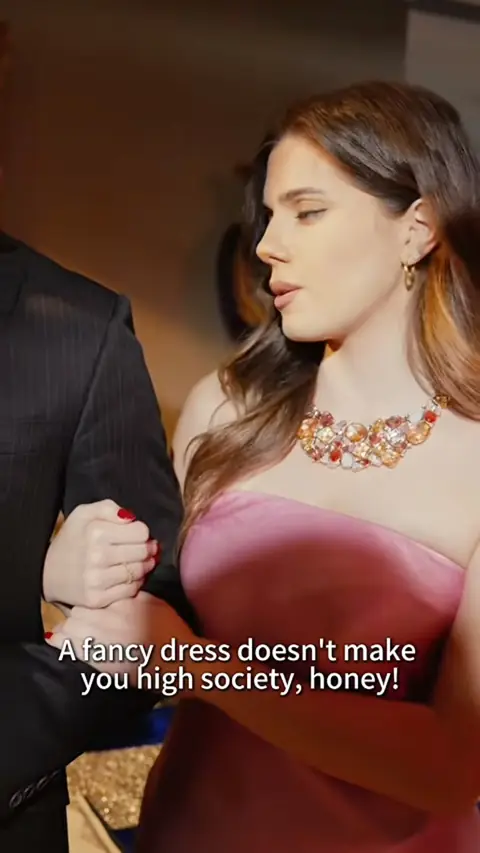 Pink strapless satin dress with a jewelled bib necklace, in Billionaire Heiress Went Undercover as a Cleaner
