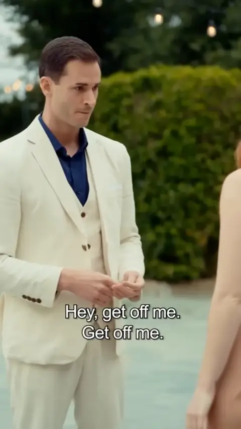 Ivory three-piece suit with a navy shirt, still at 18:55 in Accidentally Married the Mafia Boss