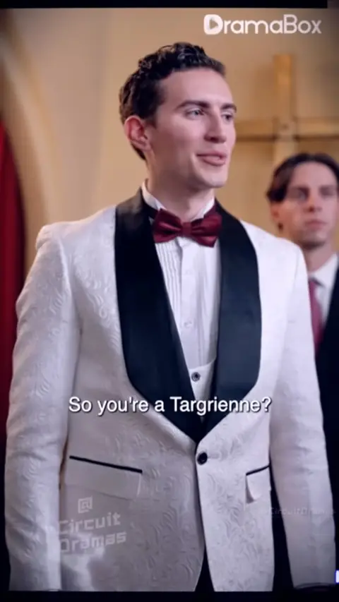 White jacquard tuxedo jacket with burgundy bow tie, in She Married a Homeless CEO