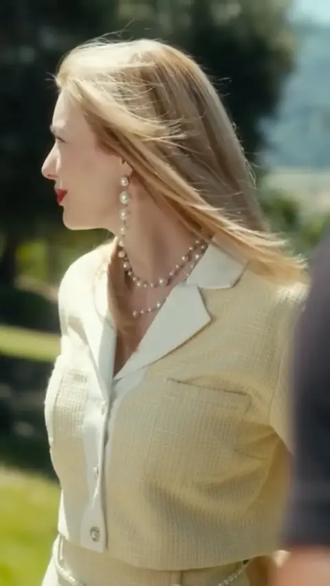 Beige tweed jacket with white collar and pearls, in The Mafia King's Sweet Wife