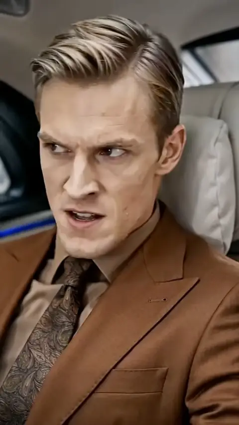 Brown suit with a paisley tie, in They Called Him a Rent-a-Cop